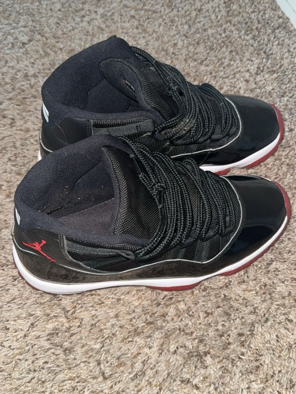Jordan 11’s High-Top Sneakers “Bred”